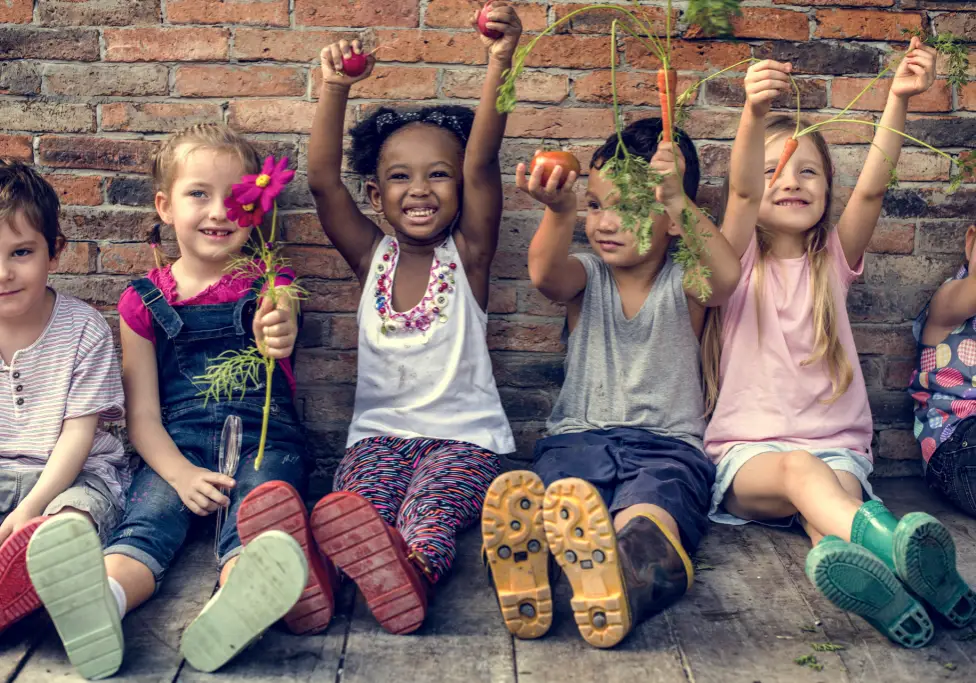 Kids Holding Plants